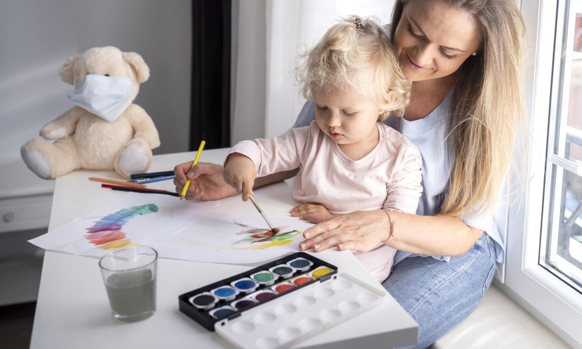 mom-helping-child-painting-home